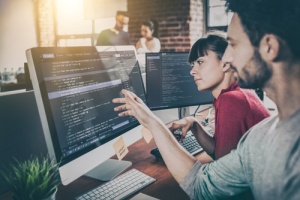 Man showing woman why cyber security awareness is important