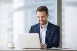 Happy man performing a FISMA compliance audit