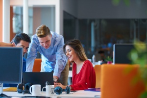 Man and Woman on Risk Assessment on laptop